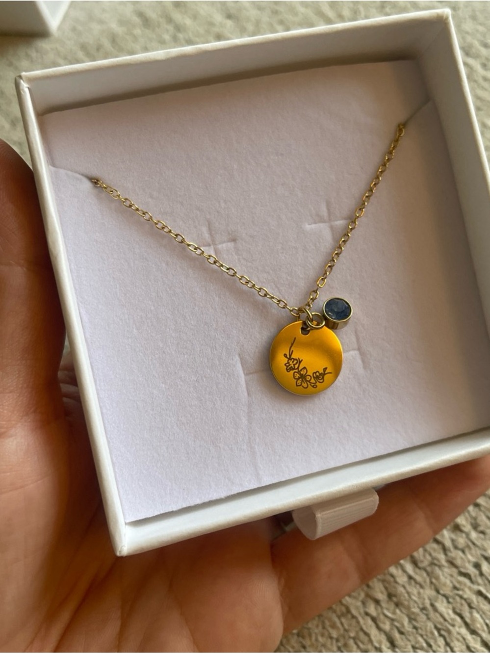 Gold Floral Disc Pendant Necklace with Blue Accent